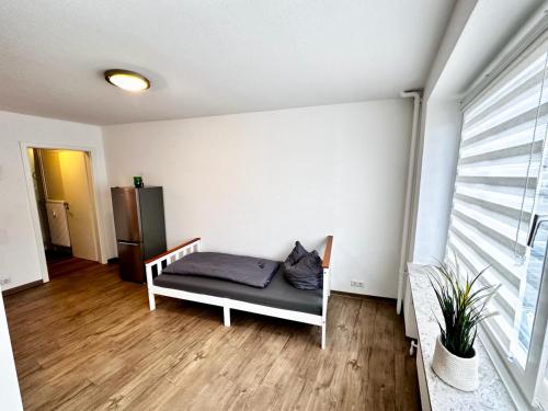 a room with a bed with a pillow on it at Moderne Ferienwohnung Nr 2 in Kleve - sehr zentral gelegen - in Kleve