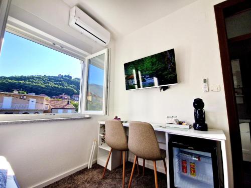 TV a/nebo společenská místnost v ubytování Apartments Miš