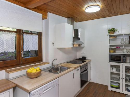 a kitchen with a sink and a bowl of fruit on the counter at Apartment Casita Alba by Interhome in Taull
