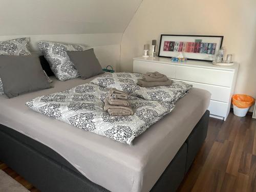 a bedroom with a bed with towels on it at Ferienhaus Mathilda in Kusel