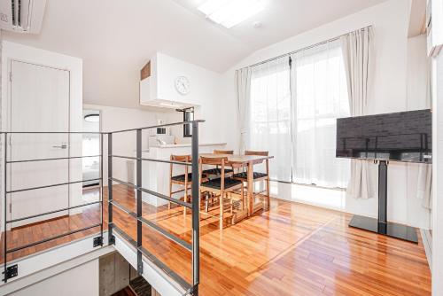 a kitchen and dining room with a wooden table at 67 Apt Nishishinjuku Premium in Tokyo