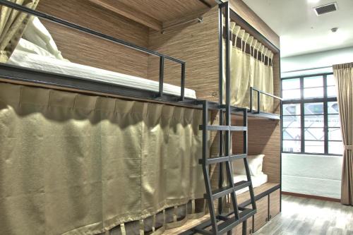 a bunk bed room with two bunk beds in it at Dream Lodge in Singapore