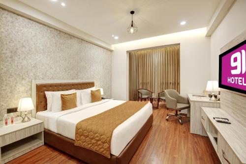Ένα ή περισσότερα κρεβάτια σε δωμάτιο στο Hotel 91 Millennium Huda