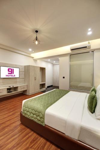 Ένα ή περισσότερα κρεβάτια σε δωμάτιο στο Hotel 91 Millennium Huda