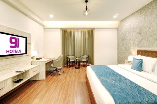 Ένα ή περισσότερα κρεβάτια σε δωμάτιο στο Hotel 91 Millennium Huda