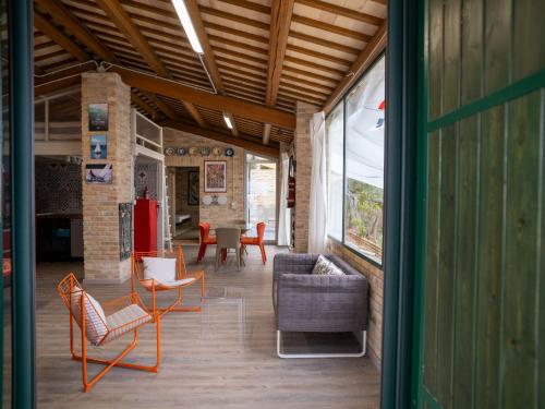 an open living room with chairs and a table at Villa Mike's Dinghy House by Interhome in Citta' Sant'Angelo