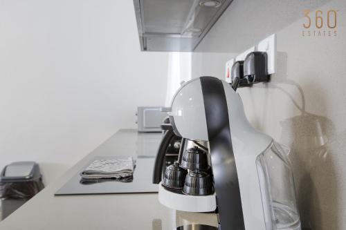 a coffee maker on a counter in a kitchen at The St Pauls Bay Escape Suites by 360 Estates in St Paul's Bay