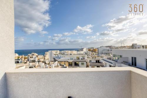 a view of a city from a building at The St Pauls Bay Escape Suites by 360 Estates in St Paul's Bay