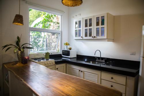a kitchen with a counter top and a sink at LiveTulum in Tulum