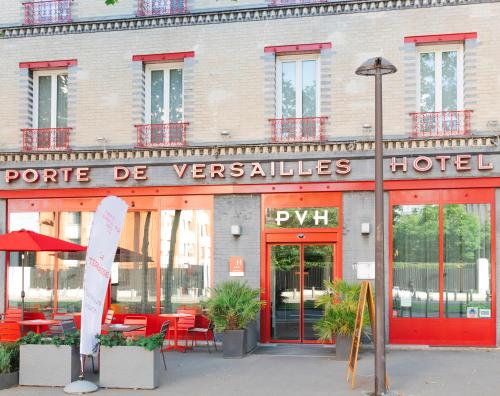 a hotel with a sign on the front of a building at Porte de Versailles Hotel in Paris