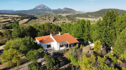 an aerial view of a white house with an orange roof at Casa El Rincón del Guardal in Huéscar