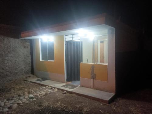 a house under construction with a light on it at SumaqWasi Huaripampa in Jauja