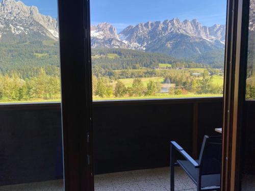 a room with a window with a view of mountains at Ellmauer Auszeit in Ellmau