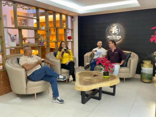 a group of people sitting in a waiting room at Hotel Boutique Ancestral in Sevilla