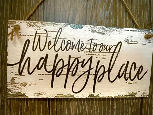 a sign that reads welcome to our happy holleyfield at Green Side Studio in Michalovce