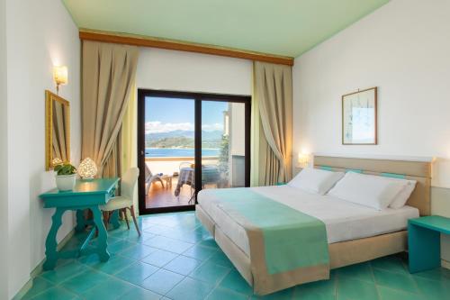Postel nebo postele na pokoji v ubytování Hotel La Torre
