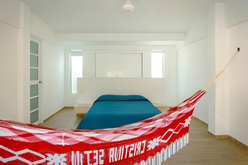 a bedroom with a hammock in the middle of a room at Modern & fresh | Villa Arroyito w/Pool & Barbecue in Cartagena de Indias