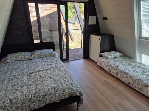 Postel nebo postele na pokoji v ubytování Camping BOSQUE DE G0RD0N