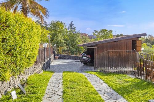 a car parked in the driveway of a house at Villa Di Mauro in Viagrande