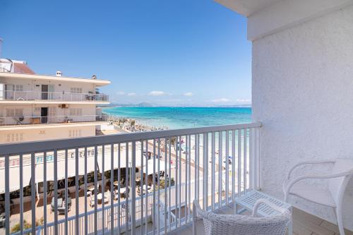 a balcony with a view of the beach and the ocean at JS Miramar in Can Picafort