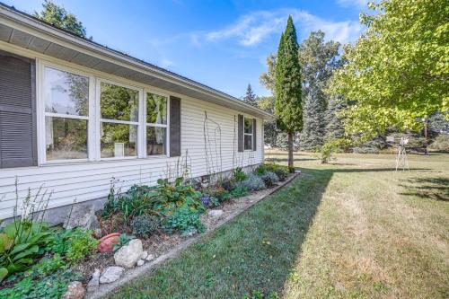 a house with a yard next to a house at Quiet Shepherd Home Near CMU Campus! in Shepherd