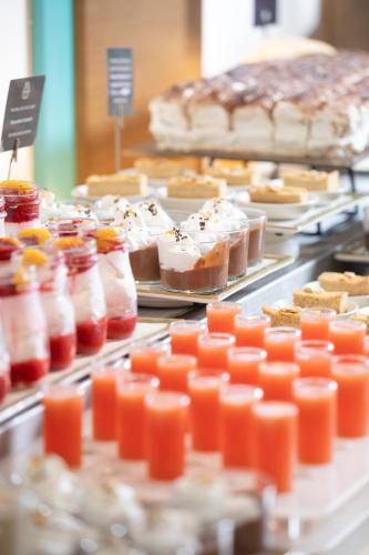 a buffet filled with different types of desserts at JS Palma Stay - Adults Only in Can Pastilla