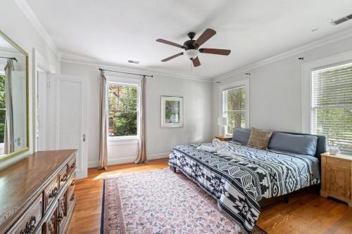 a bedroom with a bed and a ceiling fan at 5BR Atlanta Historic-Sleeps 10-Near Emory & CDC in Atlanta