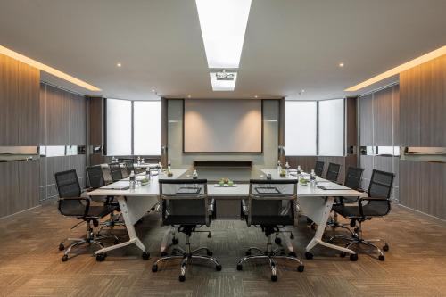 a conference room with a large table and chairs at Meliá Kuala Lumpur in Kuala Lumpur