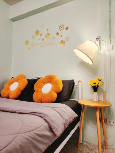 a bedroom with a bed with two stuffed animals on it at 805-STP Homely room Free Wi-Fi and Near BTS line in Bangkok