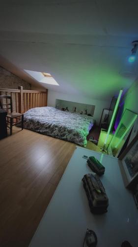 a bedroom with a bed in the middle of a room at Les chambres du Nid charentais in La Poterie