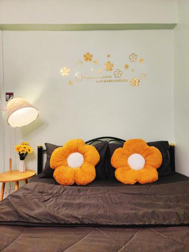 two stuffed animals sitting on top of a bed at 807-STP Homely room Free Wi-Fi and Near BTS line in Ban Yang