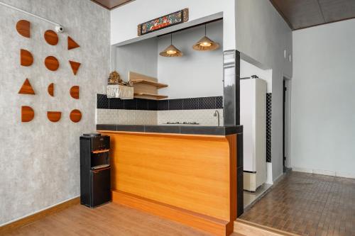 a kitchen with a wooden counter top in a room at Cove Arganta in Dalung