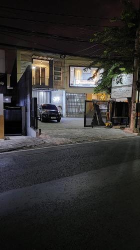 a parking lot with a car parked in a garage at De AR Guest House Gresik in Giri