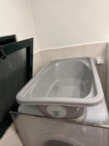 a white bath tub sitting on top of a counter at House in Camara de Lobos in Estreito de Câmara de Lobos