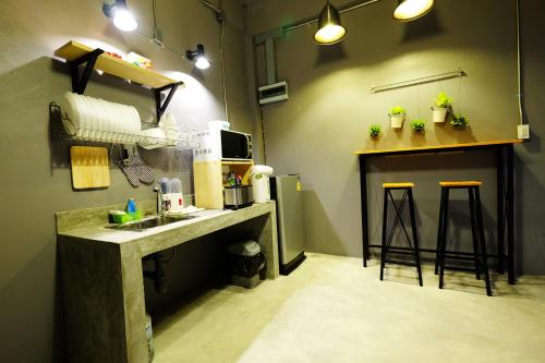 A kitchen or kitchenette at The Backpack Hostel