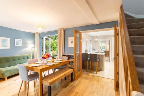 a dining room and living room with a table and chairs at Host & Stay - Clearmount Cottage in Weymouth