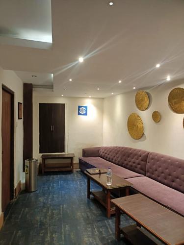 a living room with a couch and a table at zoz sm7 in Shimla