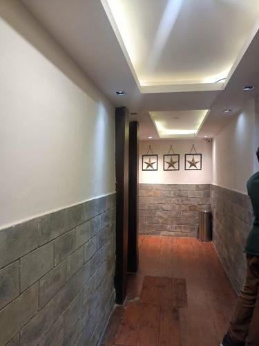 a room with a brick wall and a ceiling at zoz sm7 in Shimla