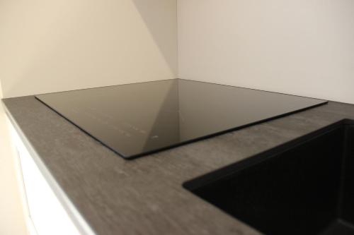 a glass box sitting on top of a counter at Residence Fontanazzo in Campitello