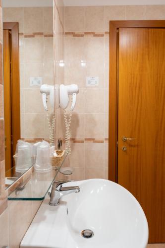 a bathroom with a sink and a mirror at Domus Hotel in Bagnoli del Trigno