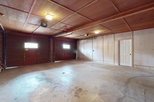 an empty room with a large concrete floor at Modern Mountain Haven in Show Low