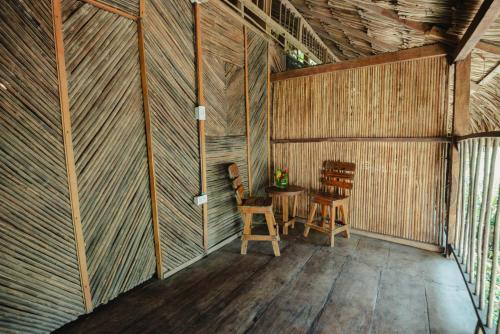 an inside view of a room with a table and chairs at Finca Escondida in Palomino
