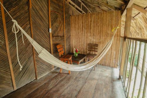 an overhead view of a hammock in a room at Finca Escondida in Palomino