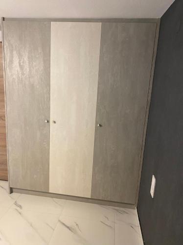 a room with two doors on a wall at Arletos Home in Ioannina