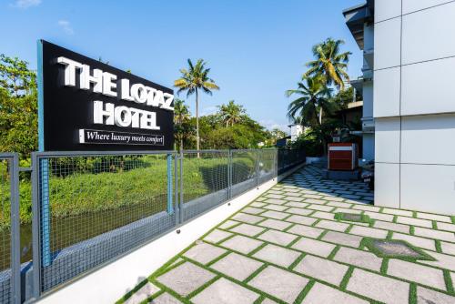 a sign for the love hotel on a fence at The Lotaz Hotel in Cochin