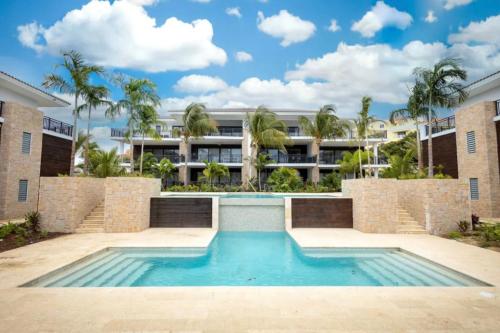 an image of a swimming pool in front of a building at Sint Michiel, Curaçao Apartaments in Julianadorp