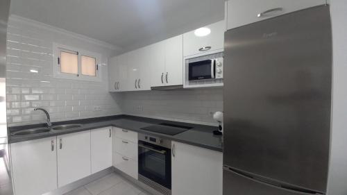 Kuchyň nebo kuchyňský kout v ubytování Apartamento Sol 523 Puerto Feliz