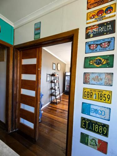 a room with a door and signs on the wall at Hostal Terraza Recreo in Viña del Mar