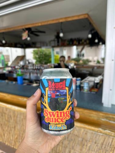 a person holding a can of swirling orange kitchen at Bayshore Resort At Put-In-Bay in Put-in-Bay