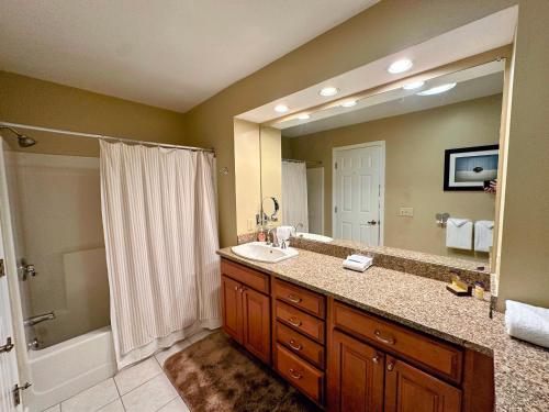 a bathroom with a sink and a large mirror at F3 Well appointed Townhome a short walk to the Mount Washington Hotel 1 minute to ski area in Bretton Woods